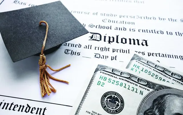 Diploma and graduation cap.